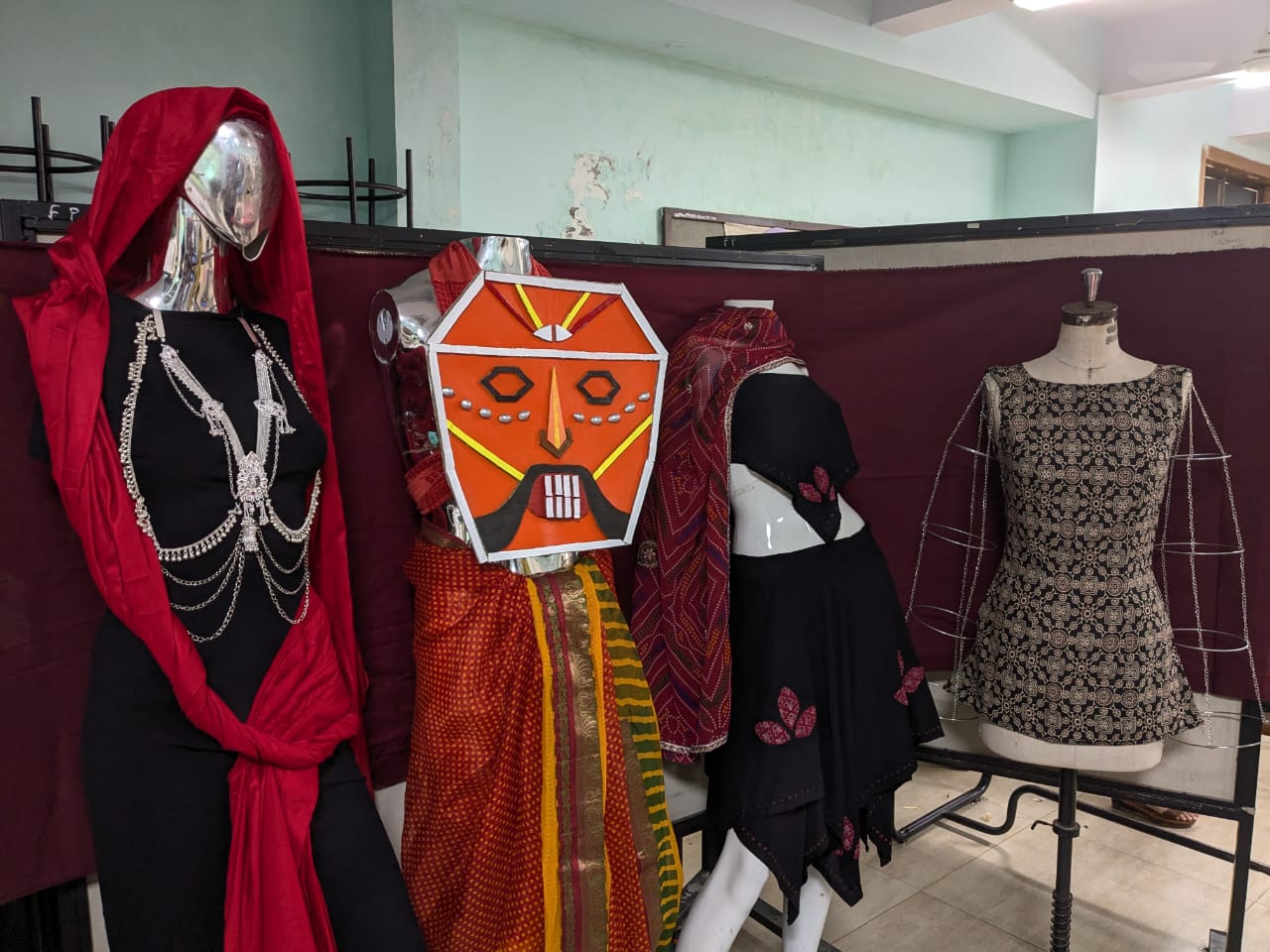 Bhil inspired design board with garment sketches, reference images and motif studies